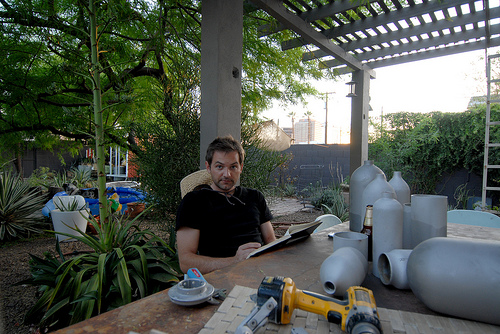 Christoph Kaiser working in his backyard oasis